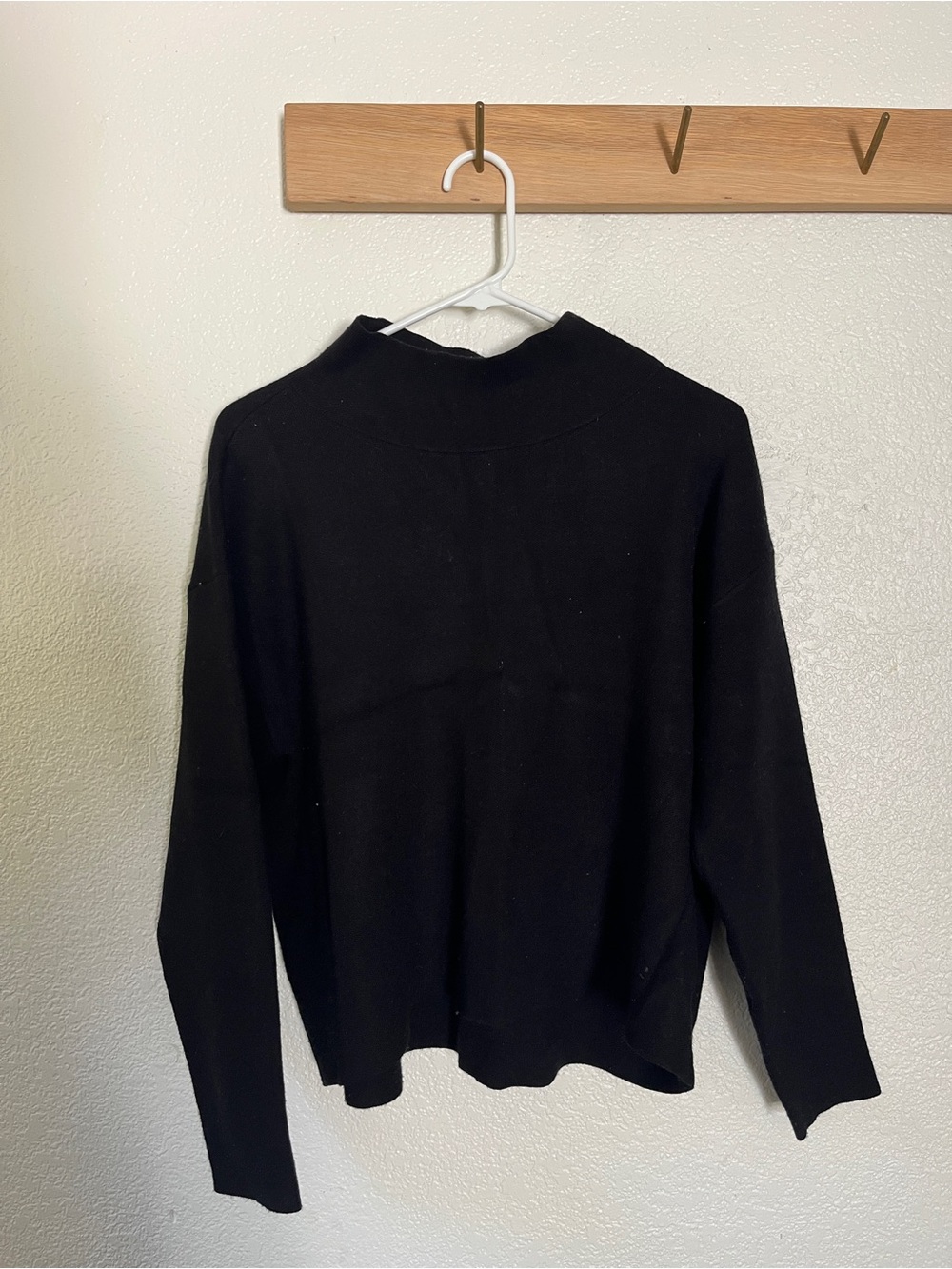 Maeve mock neck, slightly cropped sweater in black